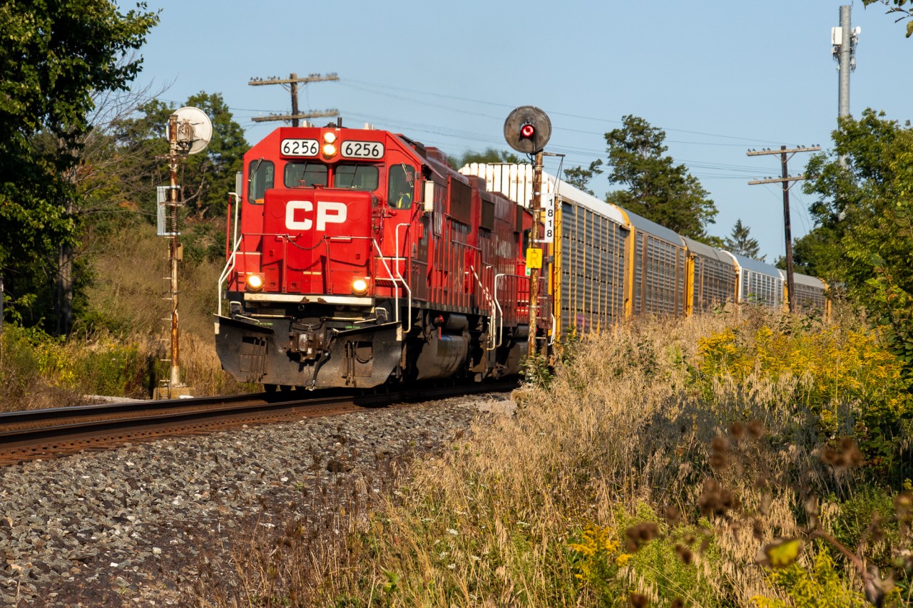 CP H19 is an interesting train. Because it runs westbound out of Oshawa around 5pm, it's almost always good light along the Belleville sub. The problem is a majority of H19s have been uninteresting power. For about 2 weeks in September, CP ran with EMDs and that's what we have here. A pair of Ex-SOO EMDs (CP 6256 and CP 4439) pull H19 through a very nice pair of searchlight signals on the Belleville sub in Ajax's north end.