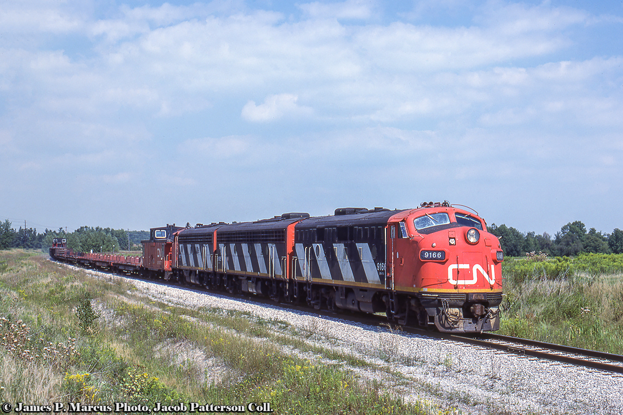 Led by a classic A-B-A set of covered wagons, CN's Nanticoke steel train approaches Stelco's Lake Erie Works.  Late summer 1986 kept photographers occupied with this train as the days of the F7s were waning.  Most shots on this site past September 1986 include GP9s in the consist:August 26: Climbing the hill through Dundas, Arnold MooneyAugust 29: Mile 1 Dundas, Arnold MooneyAugust 30: At Hamilton Shops, Photographer UnknownSeptember 2: Mile 1 Dundas,  Arnold MooneyJames P. Marcus Photo, Jacob Patterson Collection Slide.