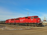 A pair of ex SOO SD60s bring tank cars from the Shell refinery into Scotford Yard.