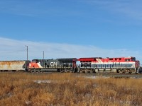 CN 3115 in heritage BC Rail "hockey stick" livery waits to depart Scotford yard eastward.