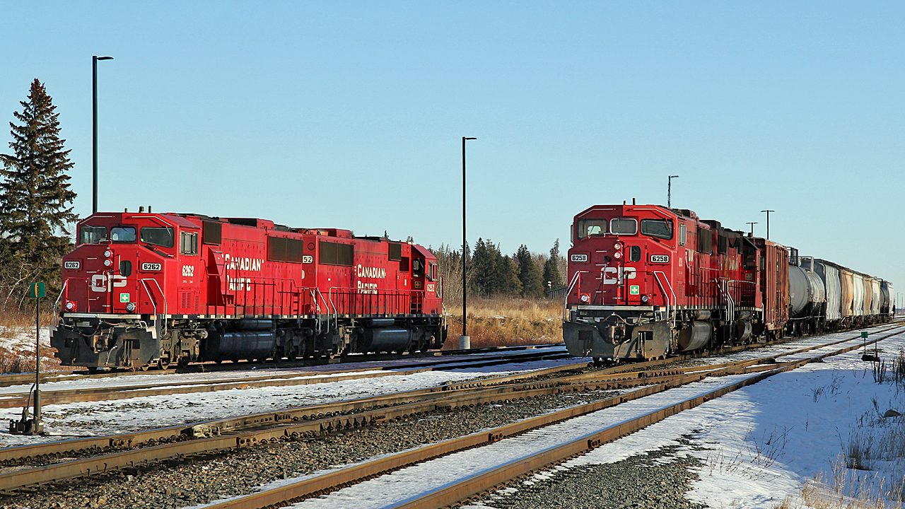 CP's Scotford Yard is home to several ex SOO SD60s. Here CP 6258 paired with GP38-2 CP 3054 are moving cars around the yard while CP 6262 and CP 6265 sit on the shop track.