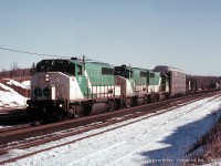 A westbound CP train is pictured heading through Guelph Junction behind a borrowed trio of GO Transit 707, 700, and 720 on March 5th, 1988