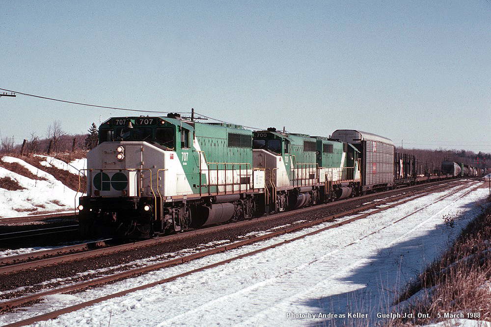 A westbound CP train is pictured heading through Guelph Junction behind a borrowed trio of GO Transit 707, 700, and 720 on March 5th, 1988