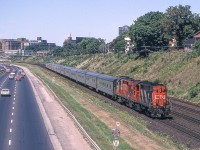 Peter Jobe photographed eastbound VIA #72 at Dowling Avenue in Toronto on August 15, 1980. Her power was CN 3107 and CN 3152.