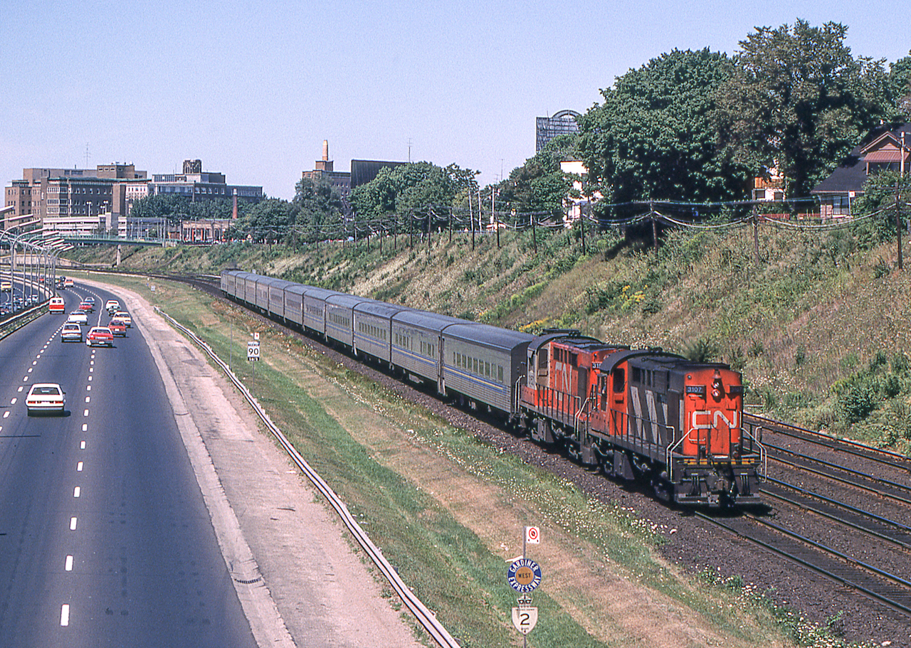 Peter Jobe photographed eastbound VIA #72 at Dowling Avenue in Toronto on August 15, 1980. Her power was CN 3107 and CN 3152.