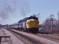 <br>
   After the station stop....
 <br>
<br>
   VIA #62  Rapido with FP9A #6533 accelerates away.... 
<br>
<br>
 At CN Guildwood mile 321 Kingston Sub, May 13, 1983 Kodachrome by S.Danko
 <br>
<br>
   Noteworthy
 <br>
<br>
   the jointed rail supported the 90 m.p.h. Speed Limit (95 m.p.h.  for  LRC)
 <br>
<br>
  and on the 62's tail end a new LRC car on a test run.
 <br>
<br>
  in the foreground at left, a new yet to be installed track switch heater
<br>
<br>
   and oh! Look at how GO Transit was so much simpler prior to the Mega expenseLinx (Metrolinx) !
<br>
<br>
   more:
 <br>
<br>
     <a href="http://www.railpictures.ca/?attachment_id=  49035">  at the Golf Club  </a>
 <br>
<br>
sdfourty