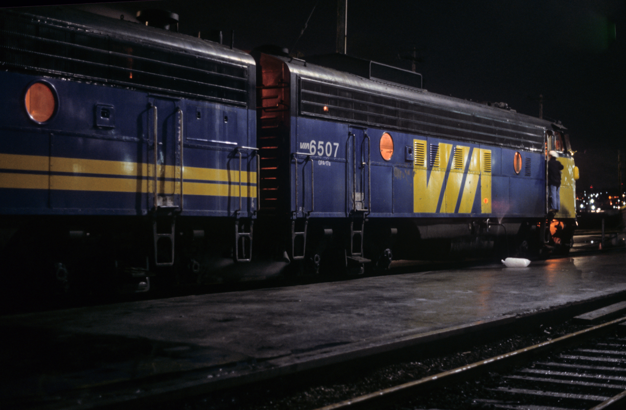 The final Super Continental after the Pepin cuts prepares for a 20:00 departure from Vancouver on November 16, 1981. It was reinstated in 1985, then cut again 1990 and The Canadian moved to it's route. 6607 was the trailing B unit. The slow shutter speed has captured a nice fan of water leaking from the fill hose attached to 6507.