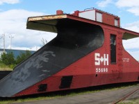 Former CN plow 55698 wears the faded colours of the Salem & Hillsborough Railway shortly after the railway ceased operations. After excursions ended most of the track was removed and the site became the New Brunswick Railway Museum. In recent years most of the equipment that had been painted in SH colours has been repainted into the paint schemes of their original owners. This included 55698 and she now wears brown paint with CN lettering.