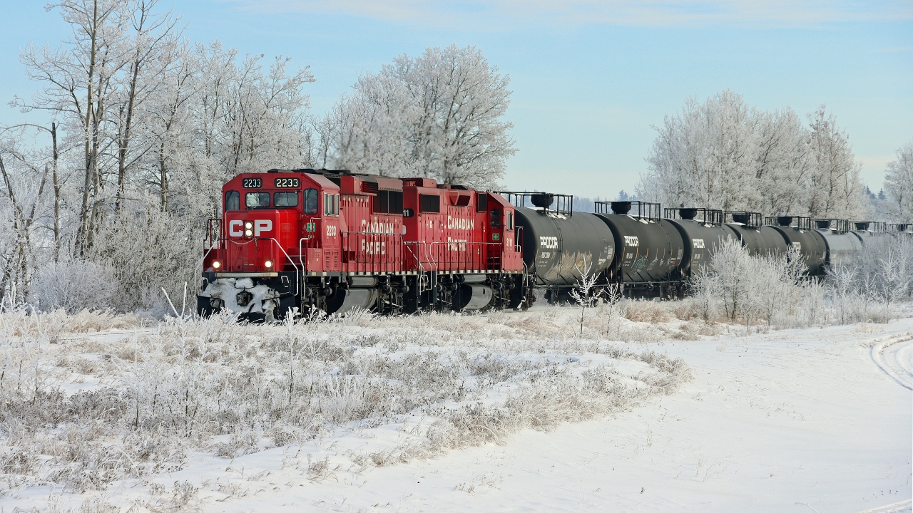In a "winter wonderland" of frost GP20C-ECO 2233 and GP38-2 3111 lead CP's B27 local Red Deer to Rimby (fhe Homeglen turn) west on the Hoadley Subdivision.