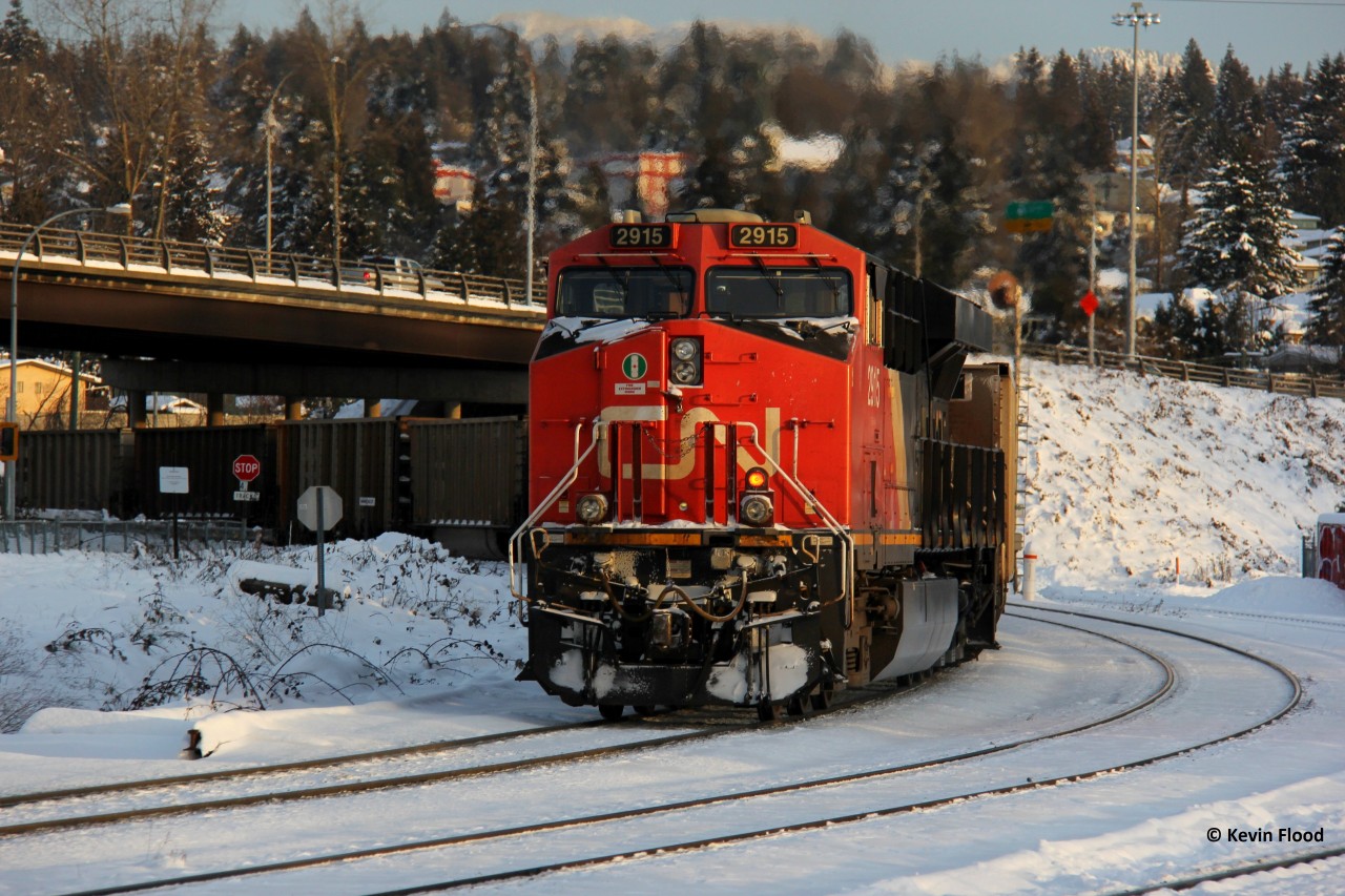 CN 2910 pushes on a coal train as it ducks under Brunette Ave. in New Westminster (Vancouver), BC. The leader was CN 3948. Vancouver area was hit with a relatively large snowfall for the area and I was able to catch some train action in the aftermath. Merry Christmas to all RP.ca contributors.