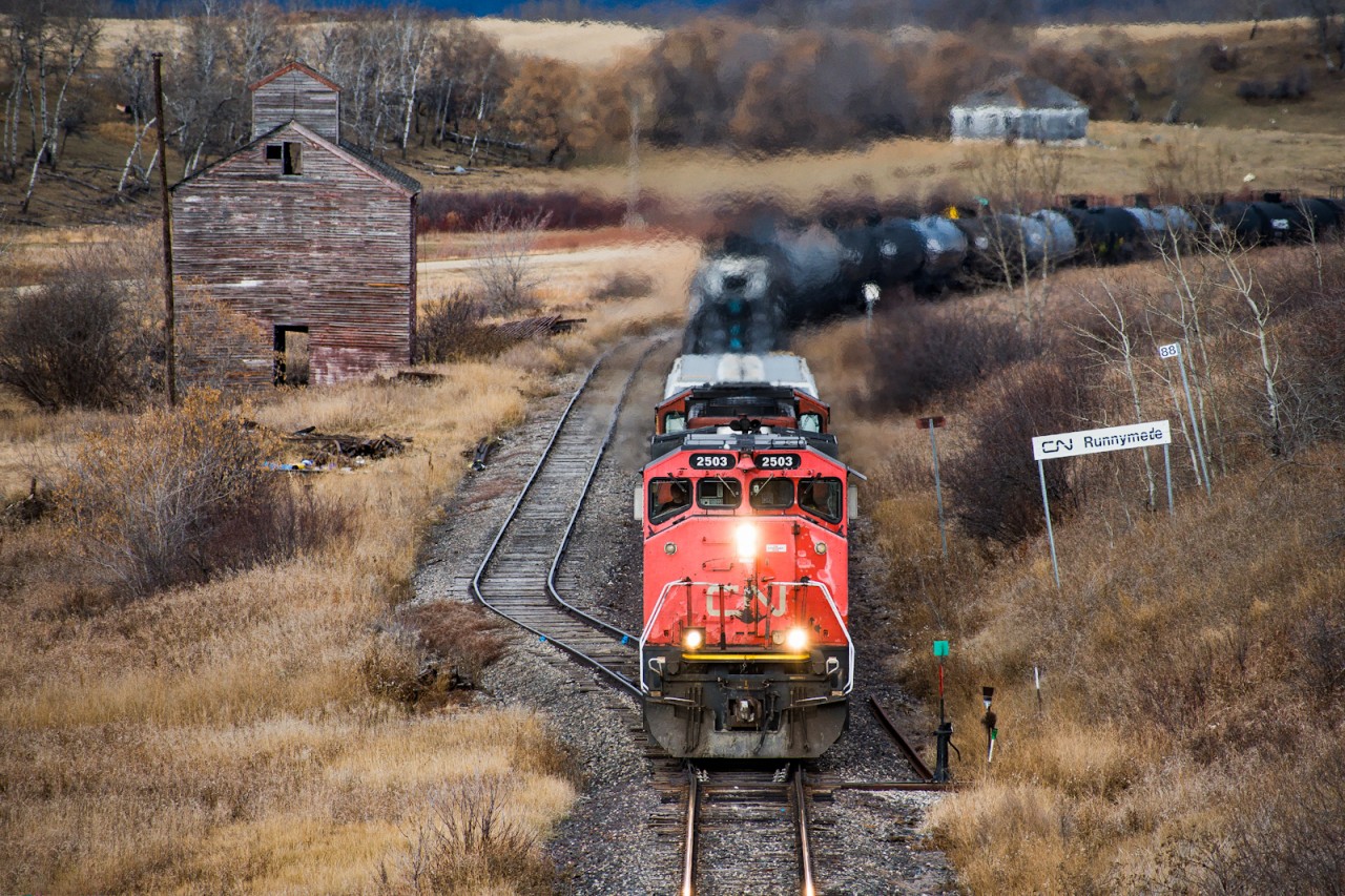 CN 2503 winds through the valleys along the Togo subdivision passing an old abandoned elevator in Runnymede SK. A few days later a large snow dump blanketed the area making this location more appealing and removing the "brown season" throughout the area. With Covid being in full swing finding trains on the subdivision was getting harder and harder so any shot I could get was worth it