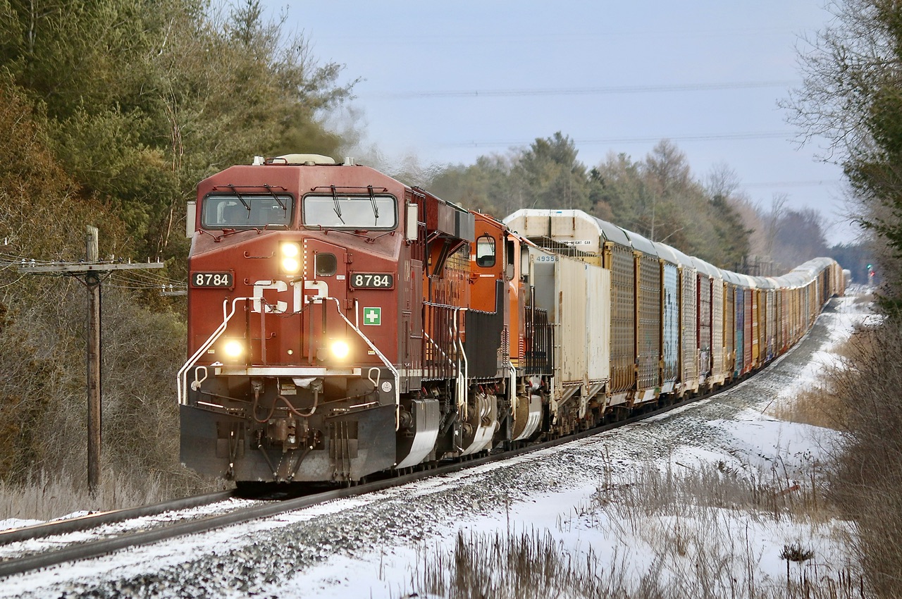 With train 135 finally clear after a morning of issues, train 137 is seen hot on its block with a pair of BNSF units trailing as the train heads westward just west of Puslinch.