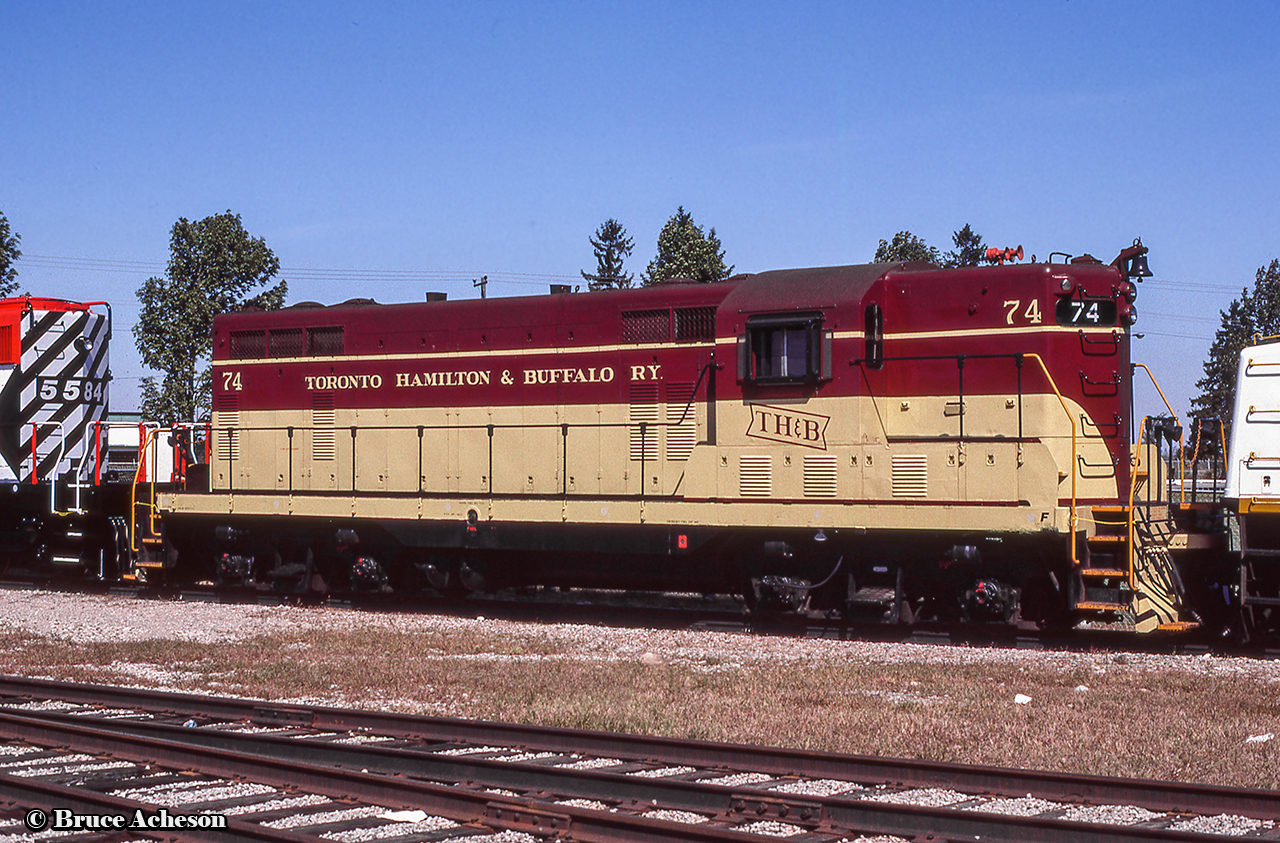 TH&B GP7 74 sits on display at GMDD London during their 1983 open house.  Built by GMD in October 1950, it would be rebuilt to CP 1684 in September, 1987 and retired by 2013.  The full consist on display included CN SD40-2LW 5330, GO Transit F40PH 515, and CP SD40-2 5584, which can be seen in Bruce Mercer's photo.More of TH&B 74:Leading the Starlight, John Eull, 1974Heading up a plow extra, Bruce Mercer, 1976Nightime at Welland, David Parker, 1980Arriving Port Maitland, Dave Beach, 1982