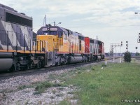 GT 5930, originally Missouri Pacific 3173, and later UP 4173, still wears it’s armour yellow paint from it’s previous owner as it trails through Burlington West, about to knock down the clear signal. Acquired shortly before this photo in 1990, the units (5930 – 5937) <a href=http://www.railpictures.ca/?attachment_id=8166>have since received GTW blue or CN paint, and are largely still active on the roster.</a>