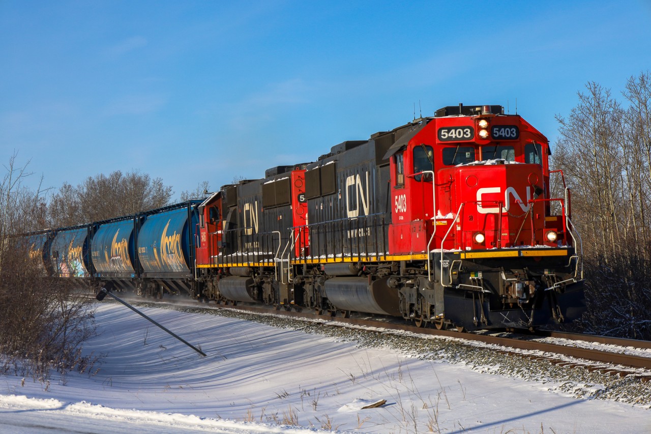 The standard cab SD60 era on CN didn't last long, however every once and a while, they escape yard service.  On one such occasion, we see the Edmonton to Camrose turn L 51851 02 rolling into Looma, Alberta about 15 miles south of Edmonton.