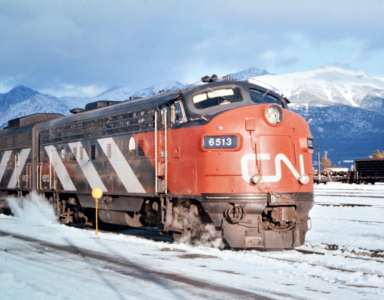 A classic profile! CN #1 The Super Continental has arrived in Jasper, AB on this frigid November day led by CN 6513. Snow on the ground and the mountains is giving passengers on board everything they expected and hoped for on this journey through the Rockies. I sure miss the sounds and smells of those steam heated consists. :-)