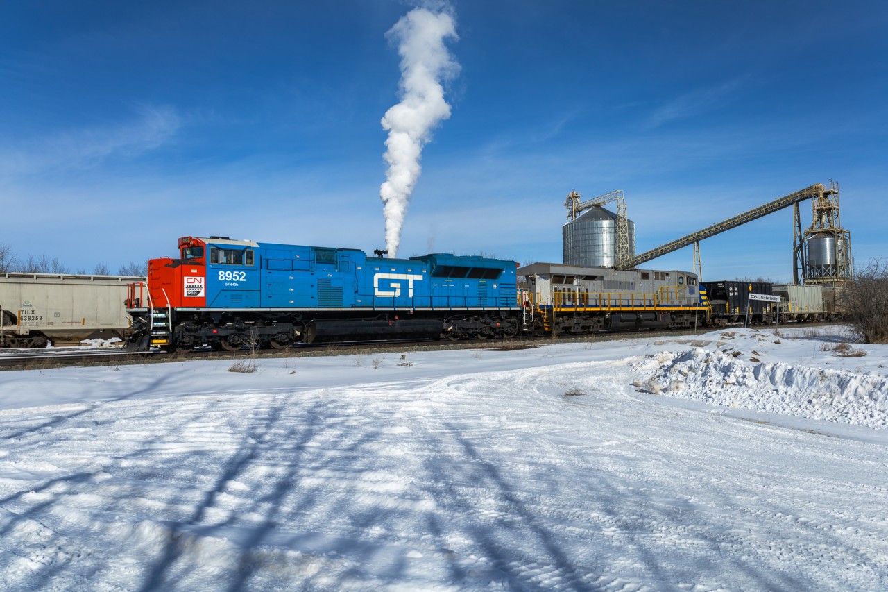 Edmonton to Cadomin U 72551 26 rolls past the Entwistle mill on a chilly February day