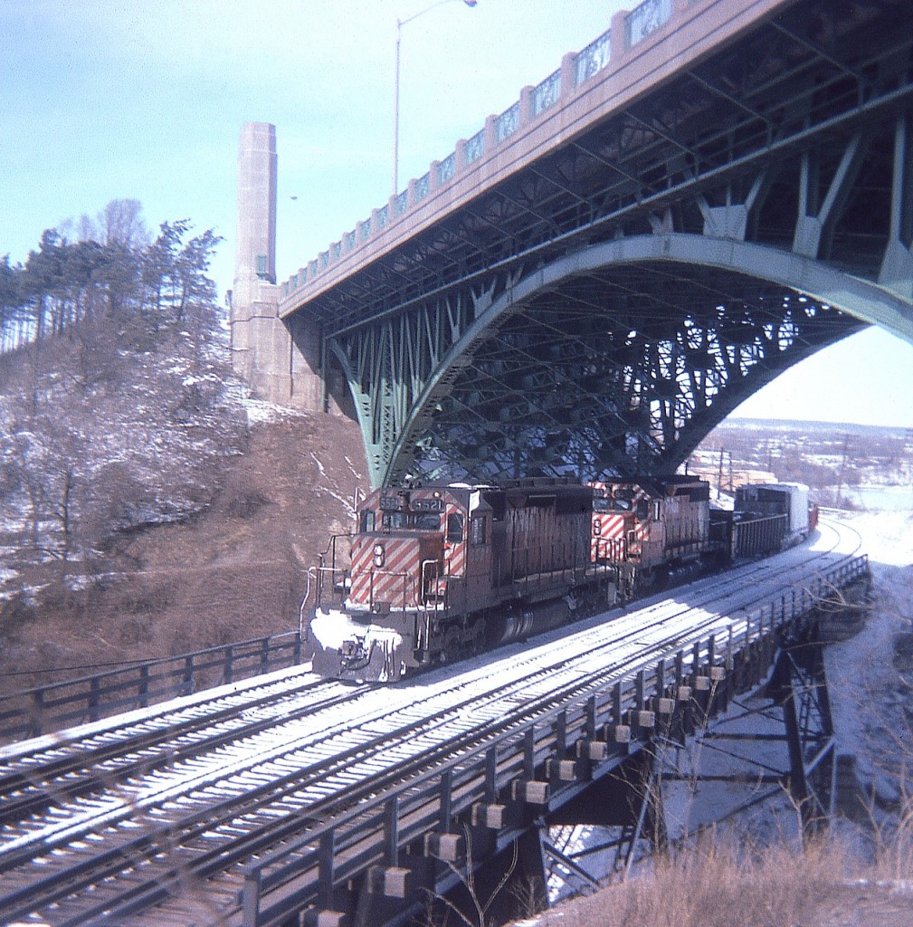 Yeah, a long time ago. For this budding curmudgeon, it was the beginning of the best of times trackside.  And more nostalgic since I have come to realize how dull so many freight moves are these days. In this shot taken hillside at the Hamilton High Level bridge (when there was still hassle-free parking) we see CP SD-40s 5521 and 5535 with mixed freight. That and the extra flags suggests to me this was the mid to late afternoon Toronto to Hamilton (and return) daily "Starlite". Looks to be a beautiful day.
