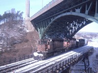 Yeah, a long time ago. For this budding curmudgeon, it was the beginning of the best of times trackside.  And more nostalgic since I have come to realize how dull so many freight moves are these days. In this shot taken hillside at the Hamilton High Level bridge (when there was still hassle-free parking) we see CP SD-40s 5521 and 5535 with mixed freight. That and the extra flags suggests to me this was the mid to late afternoon Toronto to Hamilton (and return) daily "Starlite". Looks to be a beautiful day. 