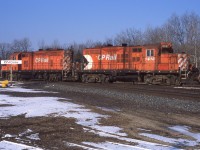 In a scene that was often repeated multiple times per day, a pair of Woodstock regulars (CP 1618 and 1505) cross the CN Dundas Sub at Carew. 