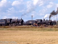 On their first fantrip together since the famed <a href=http://www.railpictures.ca/?attachment_id=48680><b>Tripleheader of May 1st 1960</b></a>, ex-Canadian Pacific steam engines 136 and 1057 (lettered "Credit Valley Railway" by owner Ontario Rail Association) operate on an ORA fantrip, stopped for a photo stop east of Fraxa Junction on the Owen Sound Sub. A switch stand can be seen by 1057 for a hydro siding, as the train is stopped adjacent to the HEPC (Ontario Hydro) Orangeville Transformer station just northwest of the town of Orangeville.<br><br>At the time the former CPR D10 1057 had been returned to steam through efforts at John Street roundhouse in the early 70's. 136 was fresh off being loaned for filming of "The National Dream" video series, and still sports much of its "old fashioned" makeover including lettering font style and placement (it would be <a href=http://www.railpictures.ca/?attachment_id=47318><b>redone with CVR lettering in 1975</b></a>).<br><br><i>Gord Taylor photo, Dan Dell'Unto collection slide.</i>