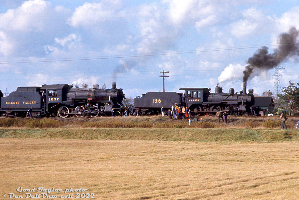 On their first fantrip together since the famed Tripleheader on May 1st 1960, ex-Canadian Pacific steam engines 136 and 1057 (lettered "Credit Valley Railway" by their owner Ontario Rail Association) operate on an ORA fantrip, stopped for a photo stop east of Fraxa Junction on the Owen Sound Sub.

The former CPR 1057 had been returned to steam through efforts at John Street roundhouse in the early 70's, and 136 was fresh off being loaned for filming of "The National Dream" video series, and still sports much of its "old fashioned" makeover including lettering font style and placement (it would be redone in 1975). A switch can be seen for a hydro siding, as the train is stopped adjacent to the HEPC (Ontario Hydro) Orangeville Transformer station just northwest of the town of Orangeville.

Gord Taylor photo, Dan Dell'Unto collection slide.