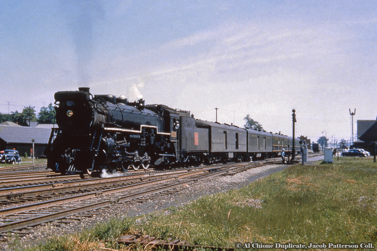 With a scheduled stop at 1031h, CNR U-1-b 6036 departs Ingersoll on the point of train 77.Original Photographer Unknown, Al Chione Duplicate, Jacob Patterson Collection Slide.