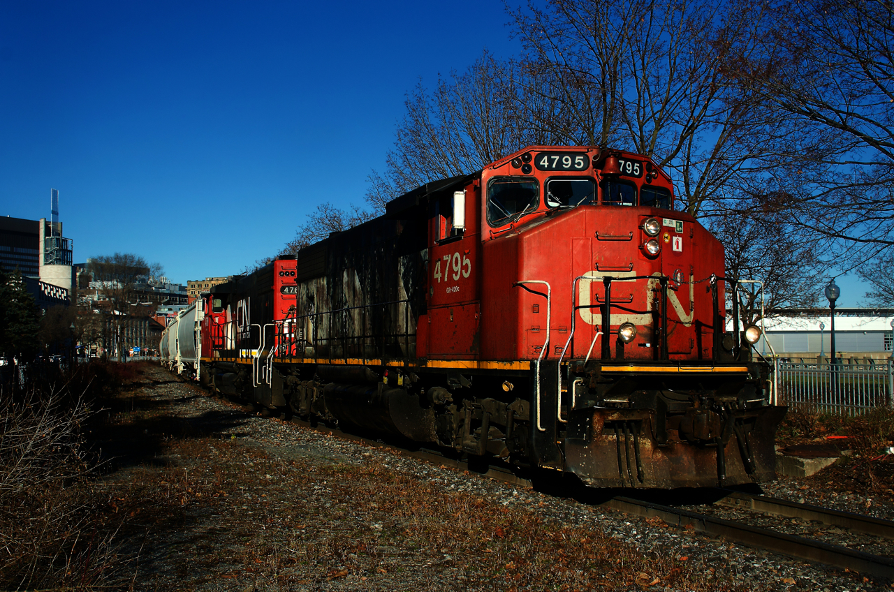 The Pointe St-Charles Switcher has GP38-2Ws in two paint schemes (CN 4795 & CN 4761) as it leaves the Port of Montreal with 1,000 feet of traffic. CN 4795 had replaced CN 4904 on this assignment just a few days earlier after having worked on it since the summer.