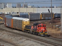 CN 7258, a venerable GP9RM decked out with IPO 15 prints from 2010, hauls a long cut of cars south as it flat switches the west end of MacMillan Yard north of Toronto on a chilly December morning. The IPO 15 stickers, highlighting 15 years of CN being a publicly traded company, sport an SD70I while this print was ironically never applied to one, being featured solely on 7258 and a handful of Dash 8s. More recently, CN introduced a small fleet of heritage units in 2020 to celebrate the 25th anniversary of this occasion.