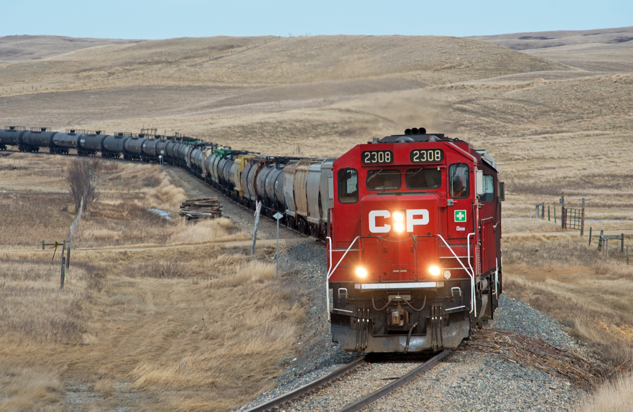 Seeing Bill Hooper's recent post of a train on CP's Expanse Sub reminded my of this spring time chase I made down the line.  This line has no shortage of scenery and is very remote. In this scene CP 2308 and a hidden 3071 lead a good sized train of interchange cars for GWRS in Assiniboia.
