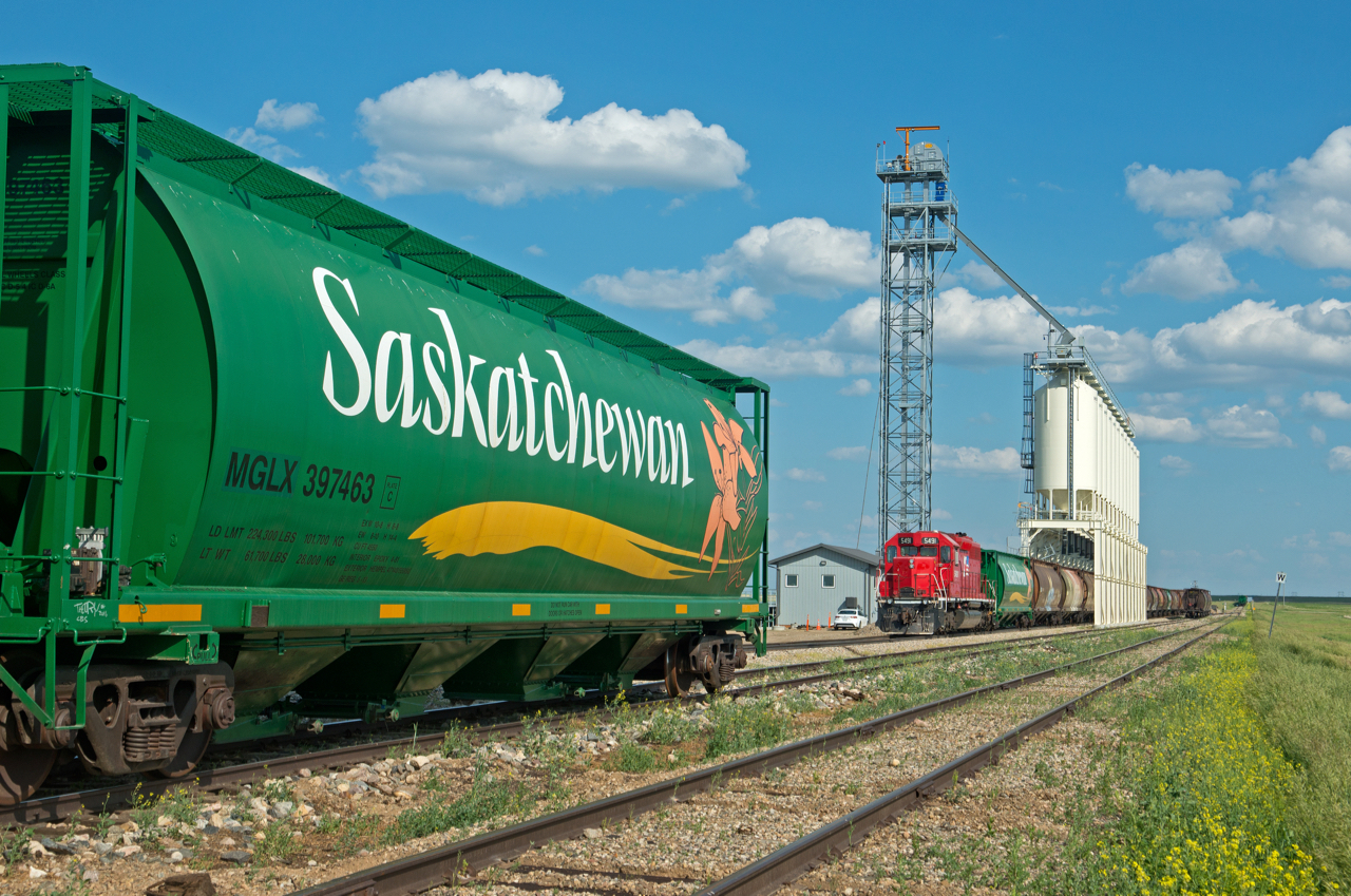 Here is one that is comforting to look at on a cold winter day.  Condie is the south end of Mobil Grain's Last Mountain Railway and pumps out the loads a fairly steady rate. On this warm Summer afternoon a clean, almost graffiti-free grain car compliments the scene nicely, as dose MGLX 5491 as it awaits its next trip north.