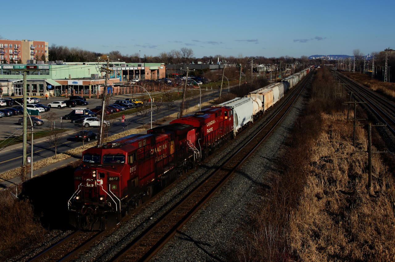 CP 231 has CP 8617, CP 9366 and 122 cars as it heads west. CP 231 is a train that started running out of Montreal just a couple of months back.