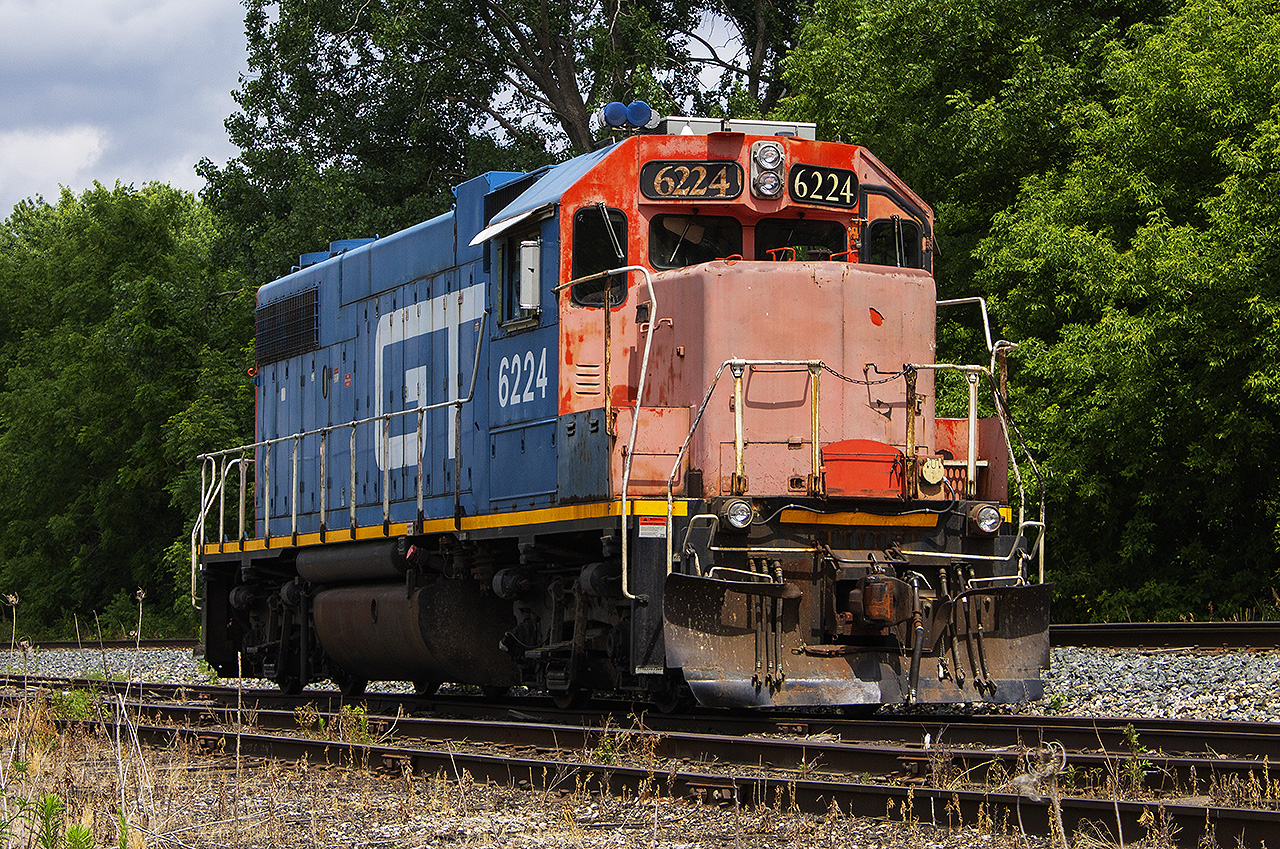 AN AMERICAN VISITOR... The Southwest has experienced it's share of 'not your average' power, and us 'foamers' in Chatham sure have had our share of the luck. Most notably, was the chase of the old venerable CN GMD-1's.  First, 1412 and 1444 in February, 2022. And,  the return of 1412 in July 2020. Here, 'FPON' unit GT 6224 in all it's glory with it's faded red front, sits basking on a mid-summer day in the siding of what remains of CN's sidings in Chatham after working local freight 514. 


Glad I got this photo when I did, as either CN or another company has since fenced off this area off of Keil Drive, making this angle no longer accessible.
