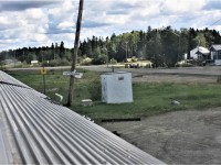 As viewed from VIA 8515 Skyline, the VIA station waiting room at Wabowden, MB is nothing more than a cement block below the HBRY station name sign behind the radio equipment bungalow. Wabowden is sandwiched between Pipun and Lyddal, and only a few hours (by train) south of Thompson, MB.