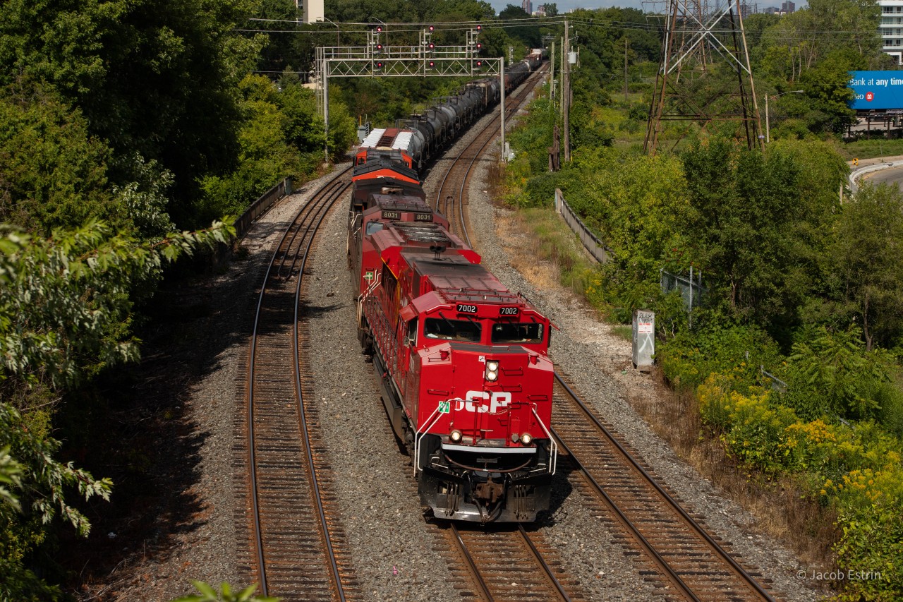 A very clean ACU numbered 7002 leads CP 420 as it slowly passes through Royal York for headroom to back into Lambton.