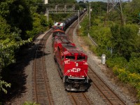 A very clean ACU numbered 7002 leads CP 420 as it slowly passes through Royal York for headroom to back into Lambton.