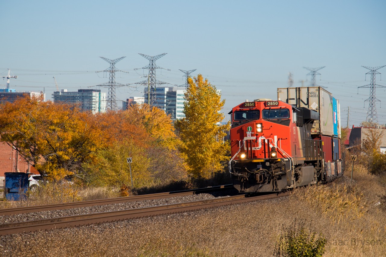 CN 121 makes a wide turn around a bush at mile 15 of the CN York sub with ES44AC 2850 solo up front. The fall colours were exceptional this year, with even the average tree or bush displaying vibrant colour.