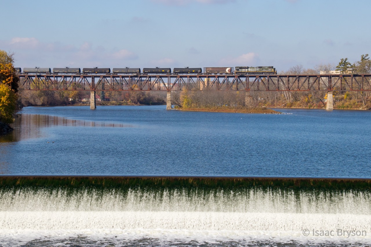 CP 528 crosses the Grand river in downtown Cambridge with military tribute engine CP 6644 solo up front. CP 6644 was painted in a replica "Spitfire" plane scheme. The Spitfires were a key part in the battle of Normandy, Also known as D-Day. 6644 was renumbered to represent the date of the battle (6/6/1944). An all around beautiful locomotive.