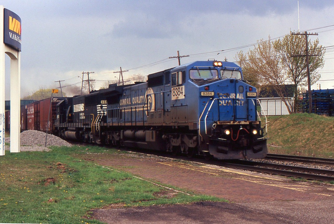 NS 327 with NS C40-8W 8384 and NS SD60 6660 through St. Catharines on the CN Grimsby Sub on May 1, 2005.