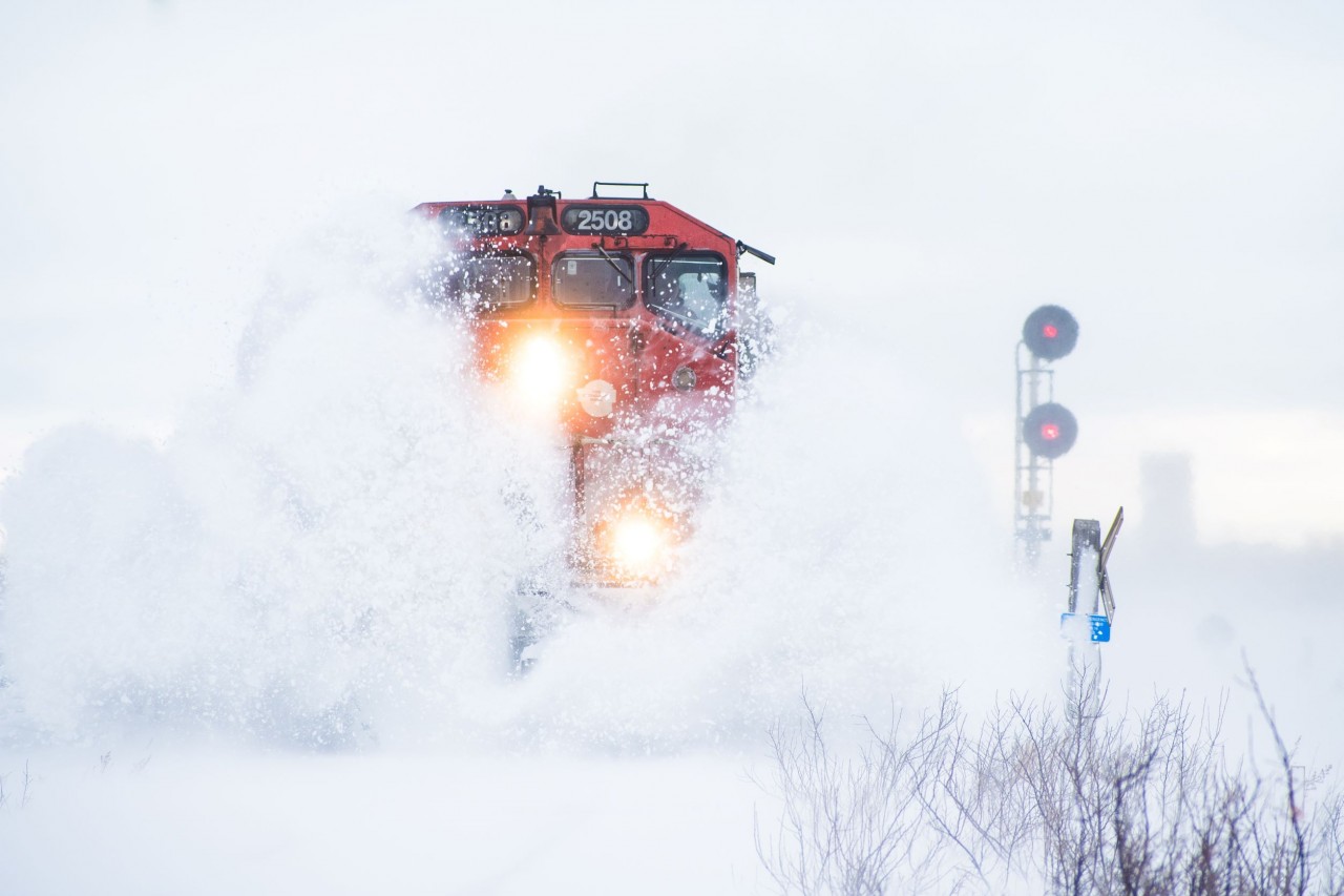 CN 2508 leads M313 towards saskatoon hitting snow drifts on its way west after an overnight snowstorm and high winds in the morning.