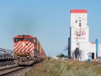 BCOL 4644 leads Q102 through Watrous SK on the Watrous subdivision passing one of several remaining elevators on the Sub. Just two days later BCOL 4642 would also lead a train east passing this elevator.