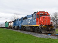 Some locomotive consists last for months on CN 580, while others do not.  Naturally, this colourful duo only lasted two days!  They worked around Brantford on this Wednesday, ran to Caledonia and Hagersville on Thursday, and I think that was it. They were quickly replaced by GTW 6425 (in CN paint) and CN 4798, which of course hung around in Brantford a lot longer.  One day 1 of 2, CN 580 is shown in Cainsville with one tank car for Blastech to be relined, and six loads of lumber to be unloaded at Rembos. 