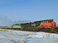 A very late running ( 15/16 hours) VIA #2 is heading east on the Wainwright Sub at North Cooking Lake with the assistance of CN 2519. Reportedly one of the HEP units on the VIA locomotives had failed.  The joys of winter operations, at the time of this shot -30C on thermometer, -40C windchill.