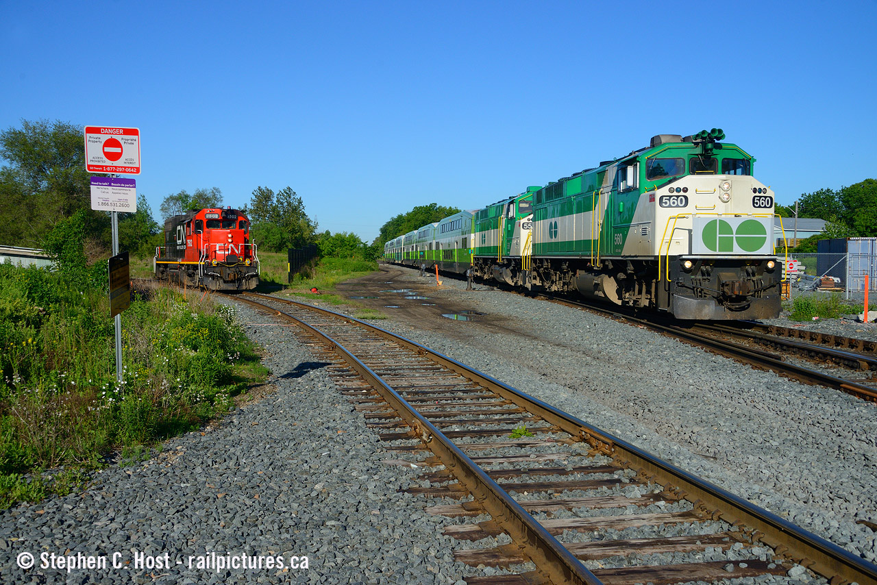 Waiting at the Junction, GO 3710 passes on the main while L542 waits patiently for the GO to pass before they can cross over and head north into Guelph after arriving from Preston in the early morning.