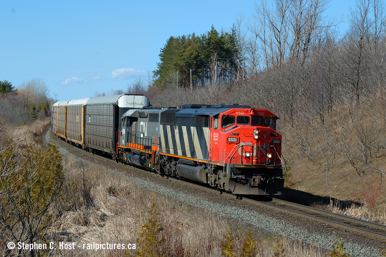 It's been slow on here - so here's an oldie. 2004, Mile 30, an every day train passes an every day location... this is probably CN 275 or 271 which were the automotive trains of the day, I recall 271 had a cut of parts on the head end usually though, possibly from Oakville. If you're looking at this and you're a photographer - submit a photo, it's been nearly 24 hours and I was the only poster safe for a couple photos that need a bit more work to get up here.. :) Post something folks!