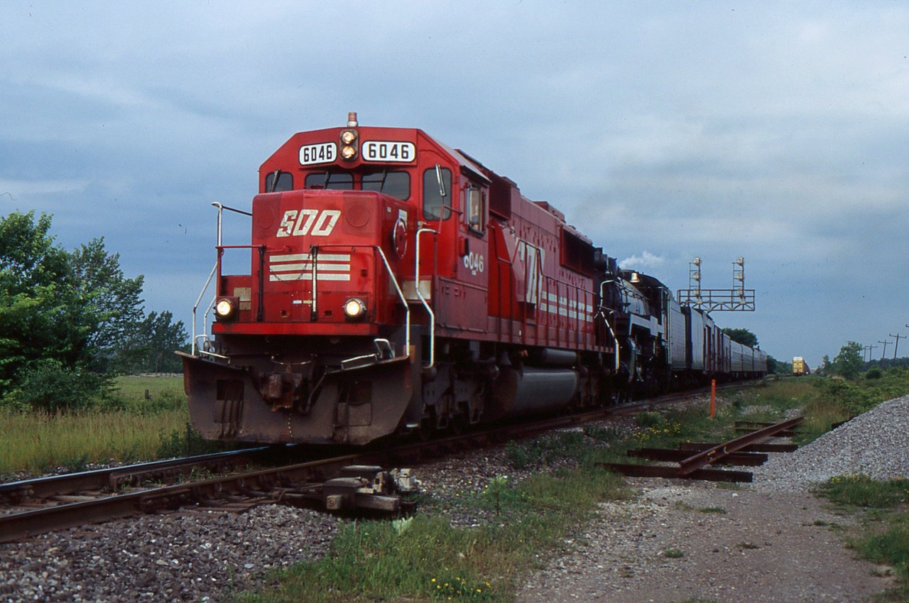 Captured: SOO SD60 6043 leads CPR 2816 at Robbins East on the CN Stamford Sub bound from Welland to Buffalo on June 13/2004.