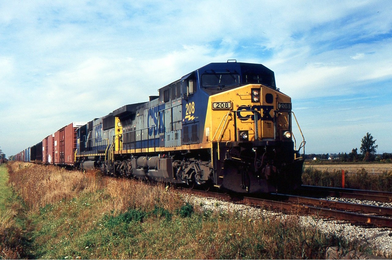 NS 328 with CSX 208 and CSX 8758 approaching St. Catharines on the CN Grimsby Sub during Oct 13/2004.