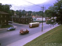 TTC PCC 4115 (part of the original 4000-4139 A1-class PCC order, built by CC&F in 1938) climbs the grade up Bloor Street West at Mountview Avenue, just west of Keele, in August 1964. Construction on the original Bloor-Danforth subway line is well underway, marked in this photo by wood constuction scaffolding at Keele Subway station visible in the distance. This portion of the Bloor streetcar line (Keele to Jane Loop) would surive the initial Keele to Warden B-D subway opening in February 1966, but service would be discontinued in May 1968 and the tracks removed after the western extension to Islington station opened.
<br><br>
<i>Robert D. McMann photo, Dan Dell'Unto collection slide.</i>