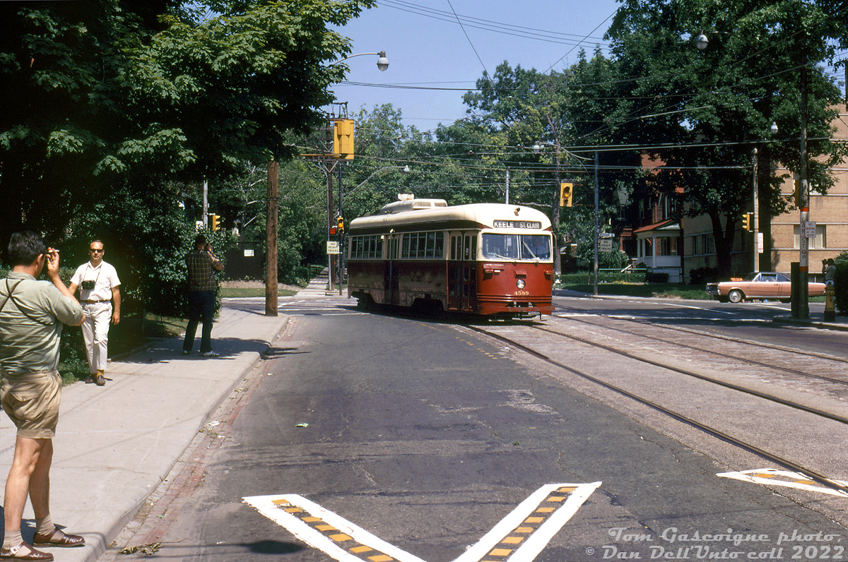 There's no shortage of cameras and Kodachrome out on this sunny day: fantrip attendees photograph TTC PCC 4589 taking the curve from southbound Mount Pleasant Avenue to westbound St. Clair Avenue East, during what was probably a farewell charter for the TTC's group of secondhand A10-class ex-Cleveland PCC streetcars (TTC 4575-4601, built 1939-40). There's even one dedicated fellow with a smoke in hand while taking his photo.

Most of this series of streetcars were retired and shipped off to Egypt in the mid-late 1960's (they became redundant due to the Bloor-Danforth subway opening in 1966 and extension in 1968), but a few A10's like 4589 hung on into the early 70's until being retired (4589 was one of ten PCC's later sold to Tampico, Mexico, where it did run for a time). Streetcar service on Mount Pleasant wasn't far behind - despite TTC's early 70's decision to not scrap its streetcar network as previously planned, service on Mount Pleasant ended in late July 1976 and was replaced by trolleybuses.

Tom Gascoigne photo, Dan Dell'Unto collection slide.