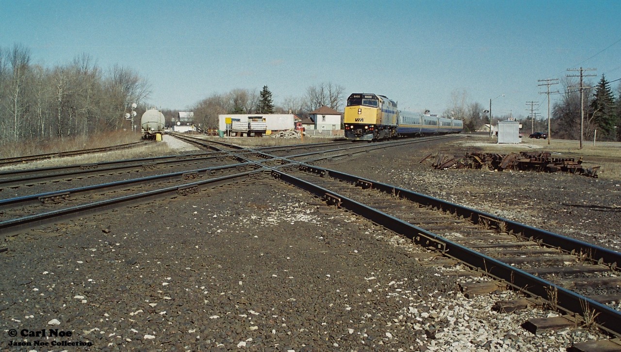 VIA Rail 73 with 6400 has just crossed Ingersoll Road and is about to hammer the diamond with the CP St. Thomas Subdivision. To the left, the tank car is sitting on the once active CN/CP interchange track.